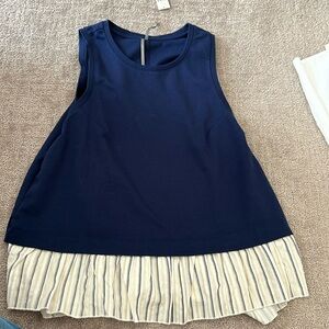 women’s open back Anthropologie tank top.